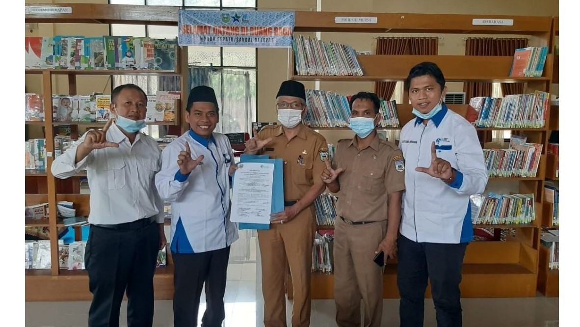 Penandatangan MoU antara Dinas Perpustakaan dan Arsip Daerah Kab.Sarolangun dan Ikatan Guru Indonesia Kab.Sarolangun
